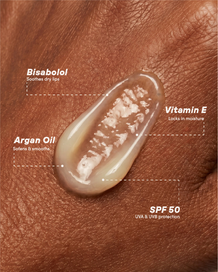 Lip balm swatch with ingredients labeled on a skin background