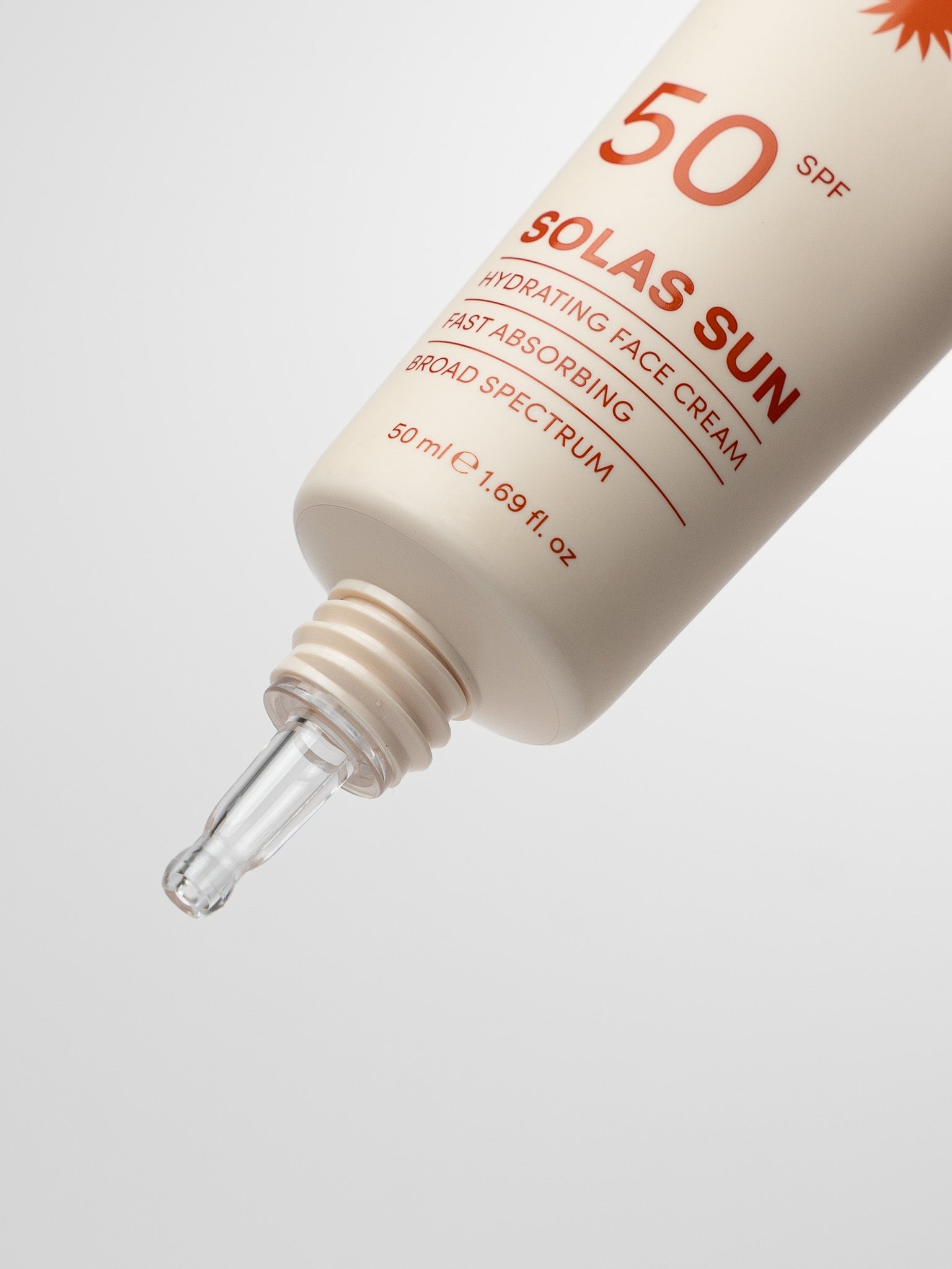 Solas Sun SPF 50 sun cream tube with precision transparent applicator on a light grey background